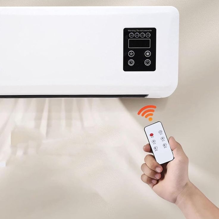 Wall-mounted mini portable air conditioner and heater unit.